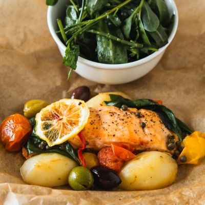 Metabolically friendly plate of food- salmon, vegetables in brown paper Metabolically friendly plate of food- salmon, vegetables in brown paper