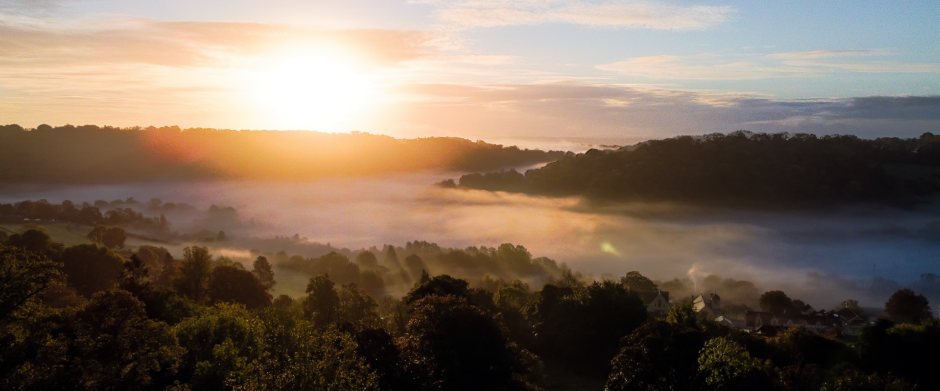Combe Grove valley sunrise in the morning covered by mist